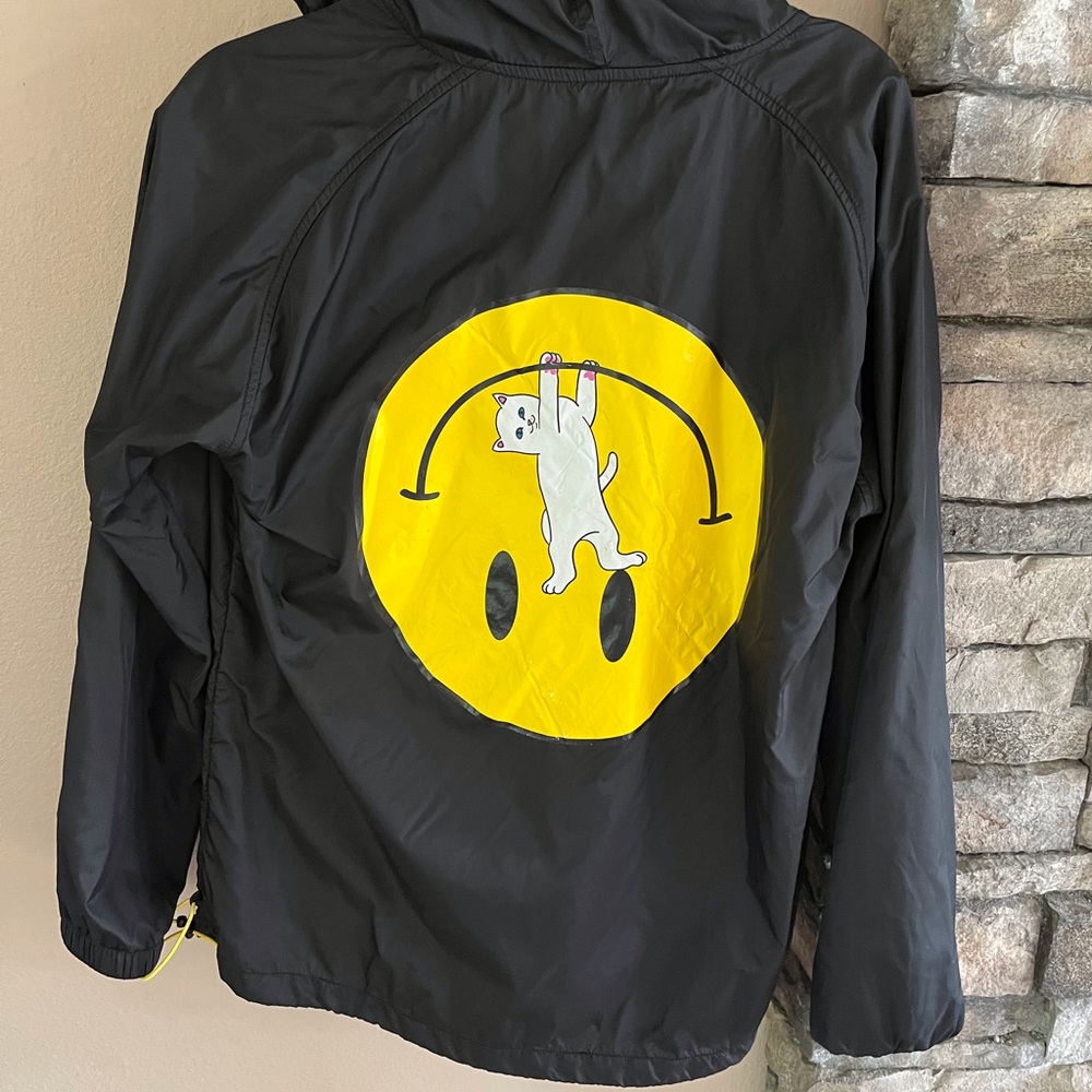 RIPNDIP pullover windbreaker w/ quarter zip, smiley and white cat. Black/ yellow